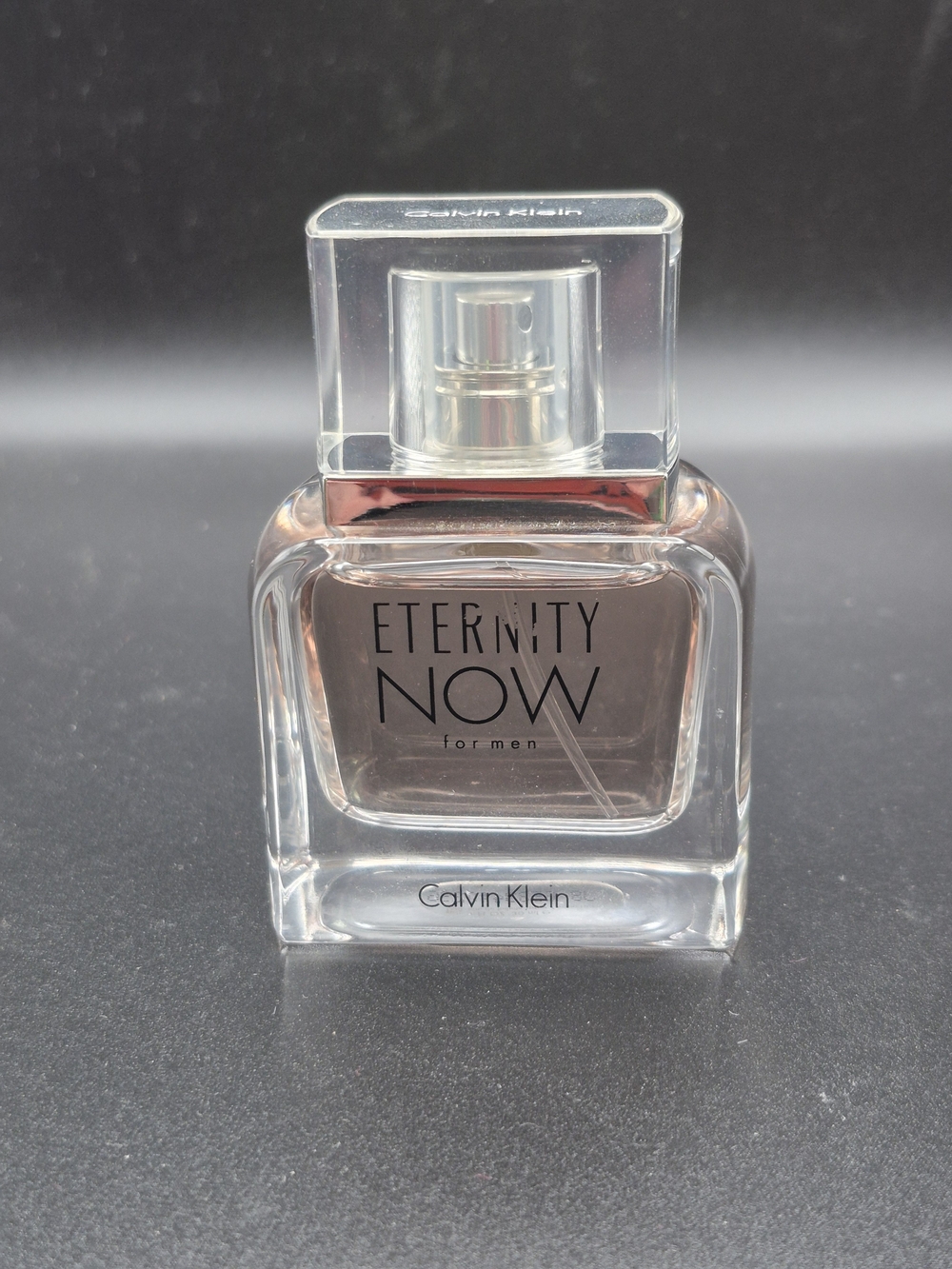 Calvin Klein Eternity Now for Men - Clear Glass Bottle with Pale Amber Liquid
